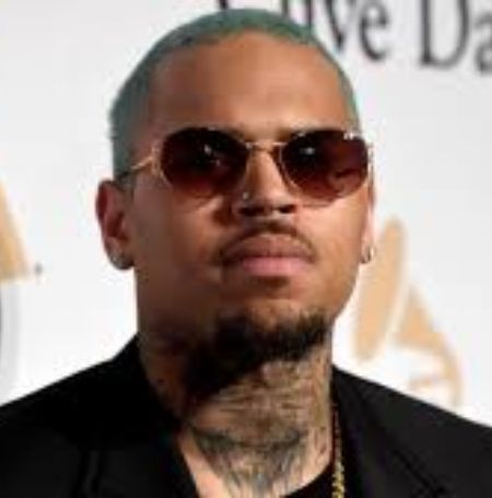 Grammy Award-winning singer Chris Brown is accused of hitting a woman during an argument on Friday.